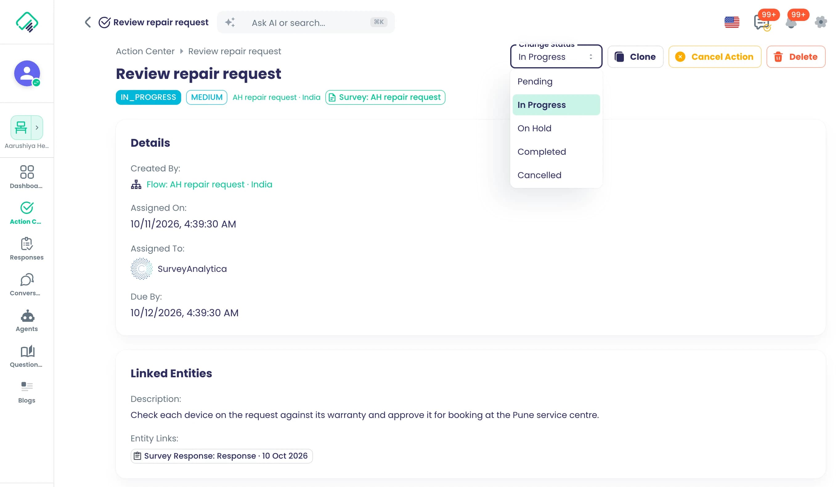 The 'Review repair request' task raised by the flow 'AH repair request · India', showing IN_PROGRESS and MEDIUM chips, a due date of 10/12/2026, and an open Change Status menu listing Pending, In Progress, On Hold, Completed and Cancelled.